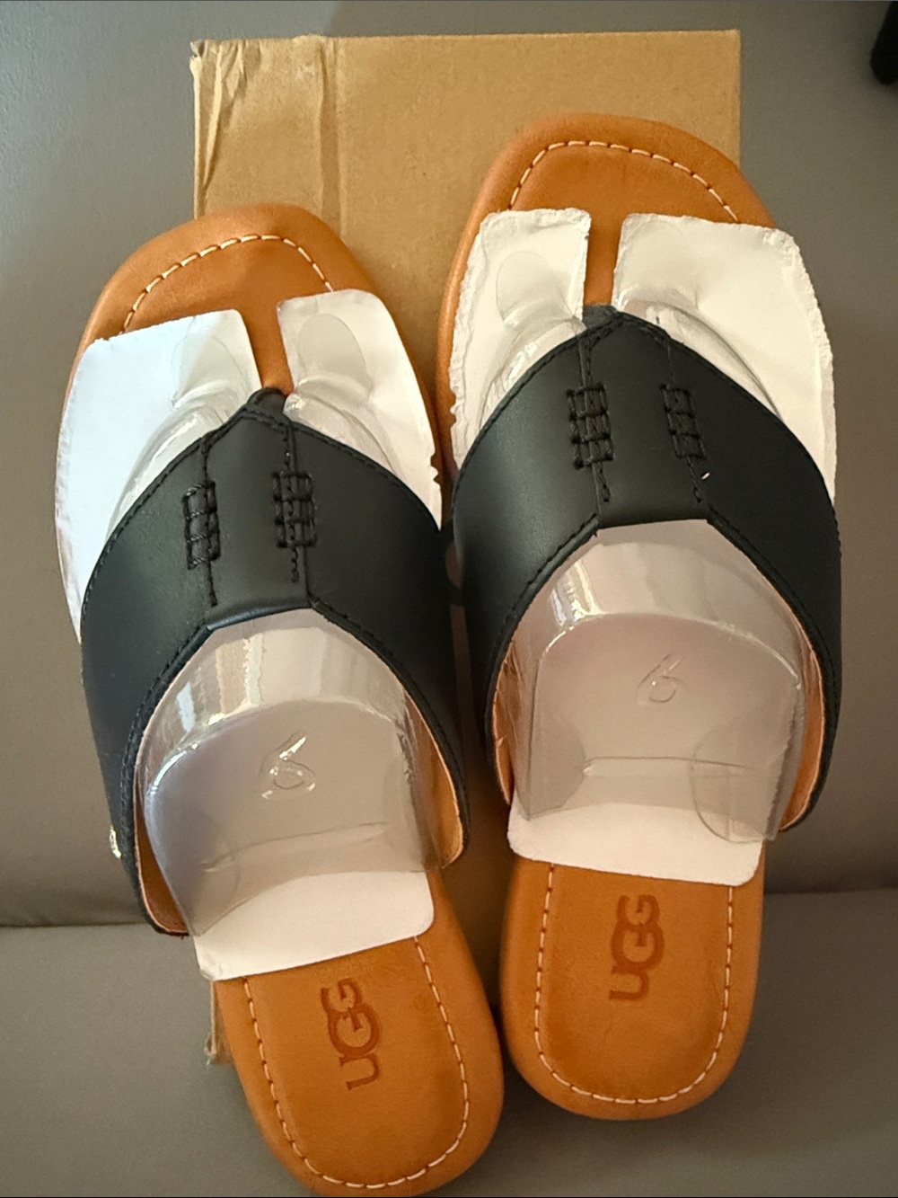 UGG Black and Tan Toe-Loop Slide Sandals